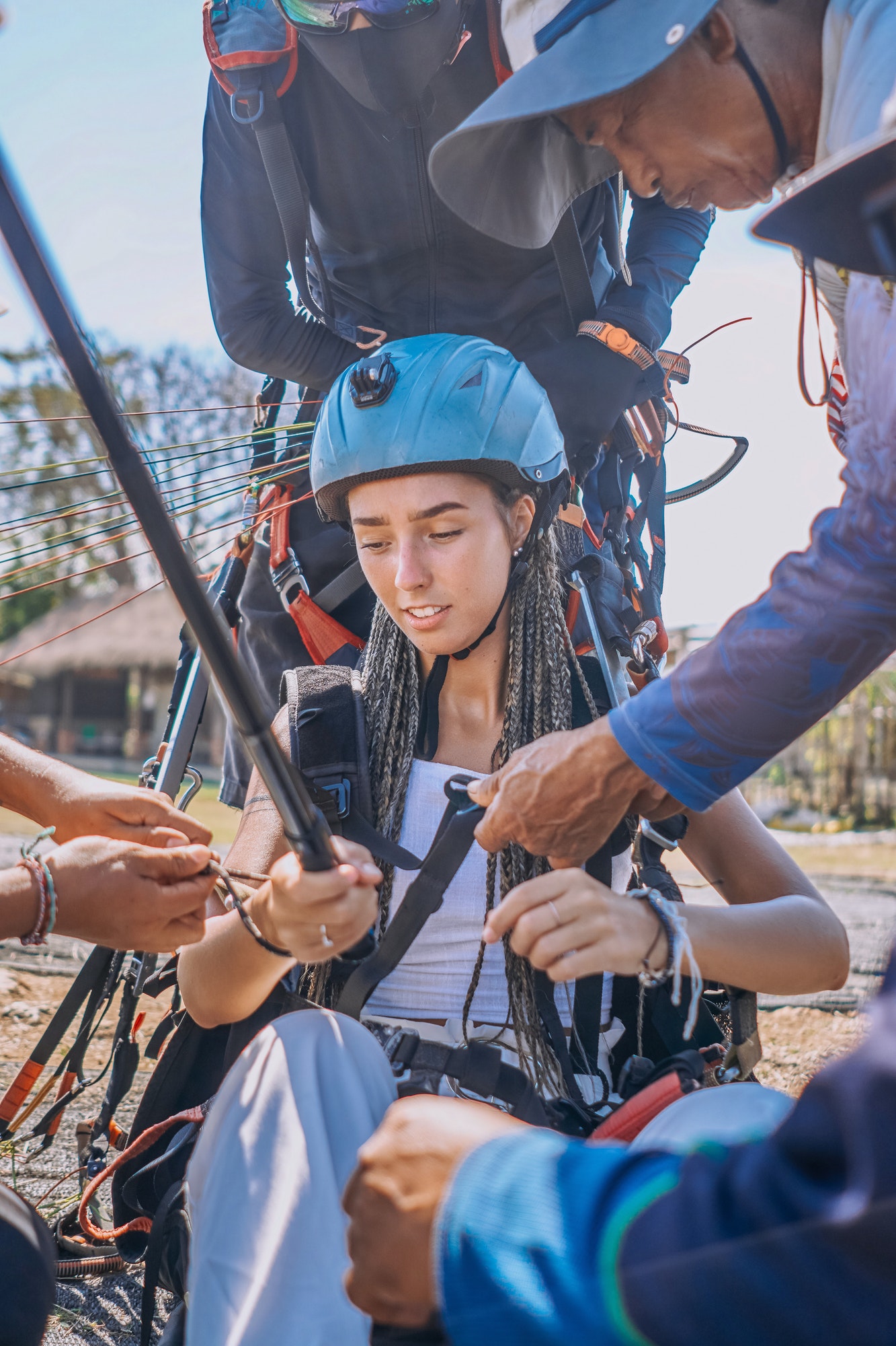 shot-of-people-preparing-woman-for-skydriving-in-bali.jpg